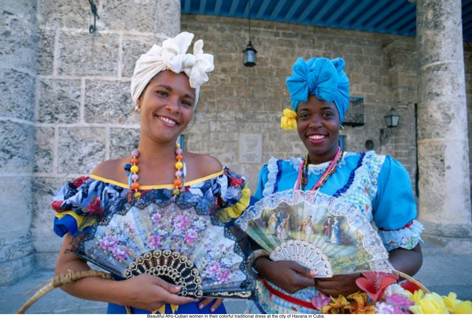 Beautiful Afro-Cuban women in their colorful traditional dress at the