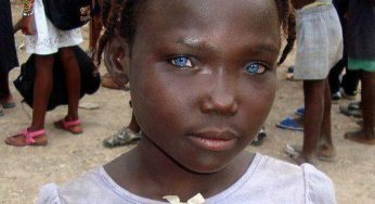 Haitian black girl with beautiful and blue eyes.